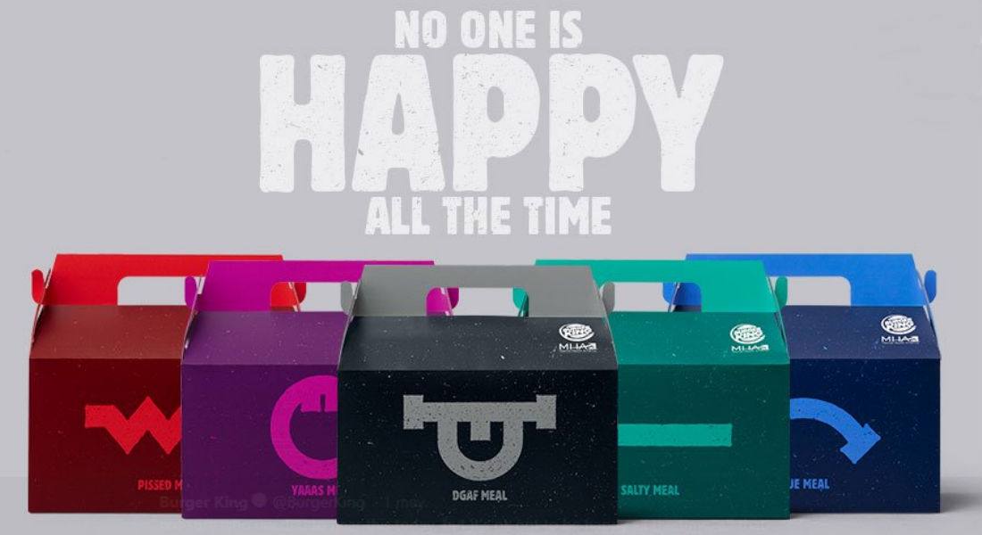 Cajitas de comida rápida de colores con el eslogan No one is happy all the time